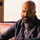 Bernard looks stern as he sits in a booth at a diner.